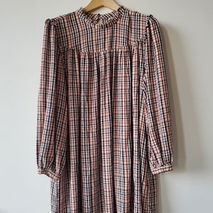 Knee length plaid dress.